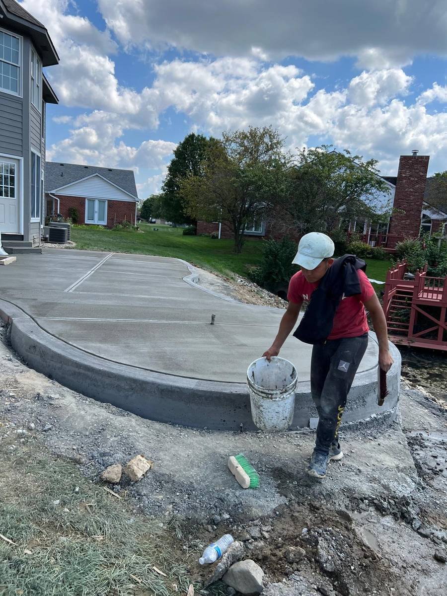 Power trowel finishing a concrete slab