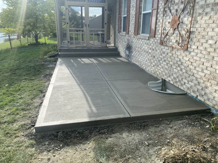 New broom finish patio and walk beside brick ranch in Brownsburg, Indiana