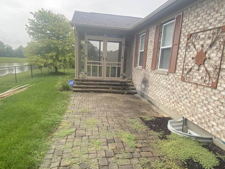Old paver walk to screened porch, before removal in Brownsburg, Indiana