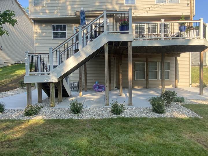Patio and walk under a raised deck in Carmel, Indiana
