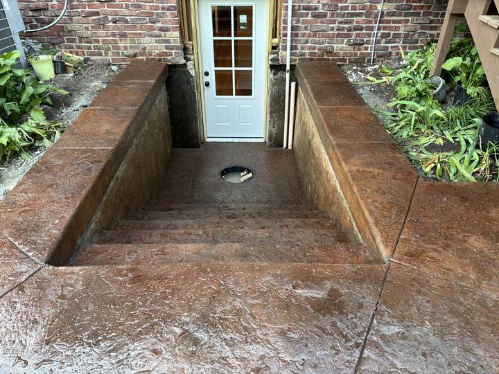 Colored stamped stairwell and landing at a basement entry in Carmel, Indiana