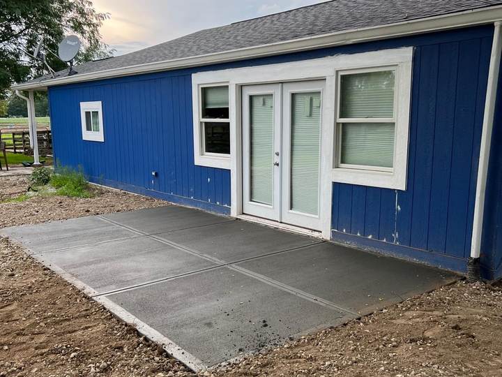 Patio at a blue sided house