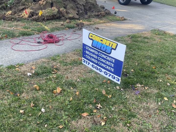 Company yard sign and work truck on site in Indianapolis, Indiana