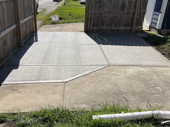 Driveway running between fence and garage in Indianapolis, Indiana